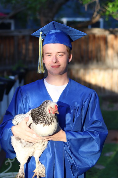 Patric Neill, 18, STEM School Highlands Ranch, accompanied by his chicken Gladys
